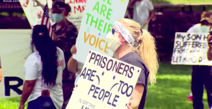 Protesters outside of the Texas Governor's mansion call for improved conditions in TDCJ