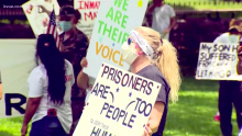 Protesters outside of the Texas Governor's mansion call for improved conditions in TDCJ